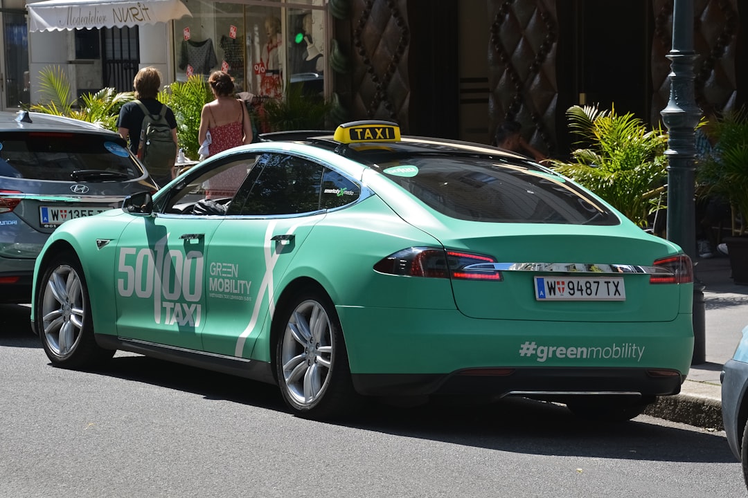 green porsche 911 parked on street during daytime