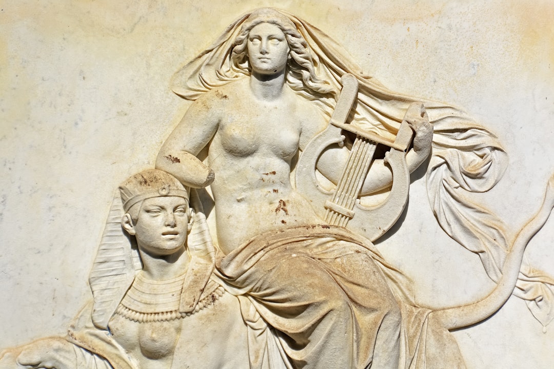 woman in dress concrete statue
