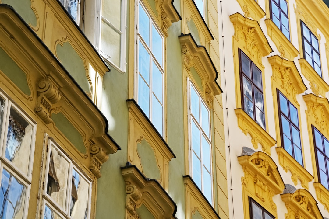 brown wooden window frame on white concrete building