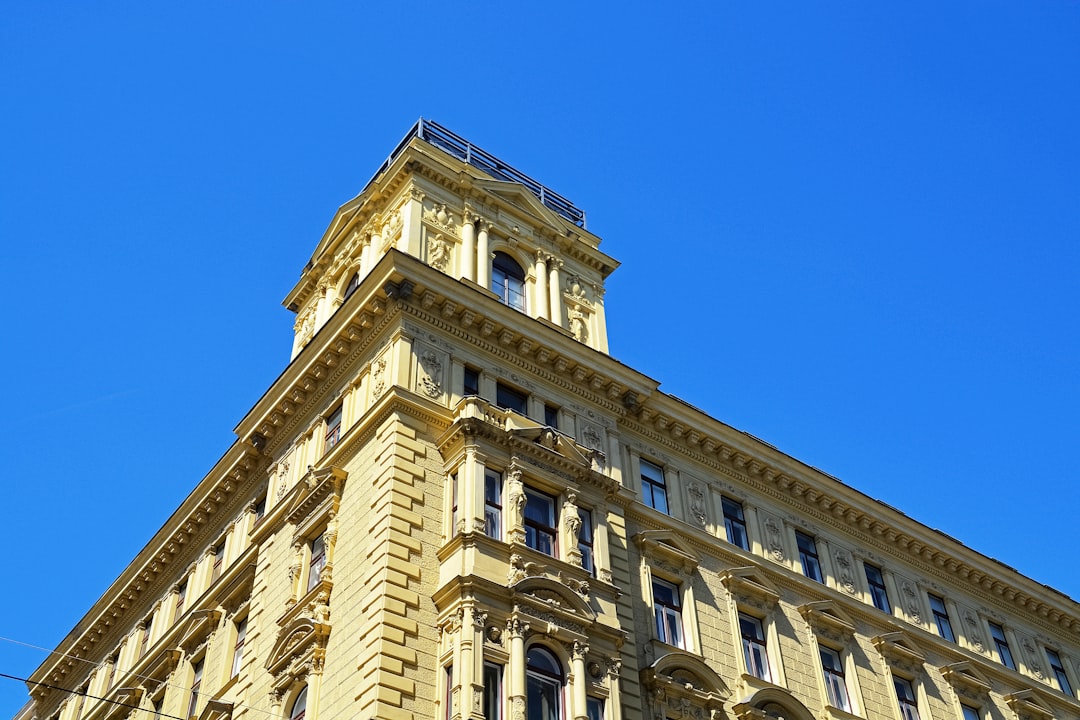 beige concrete building under blue sky during daytime