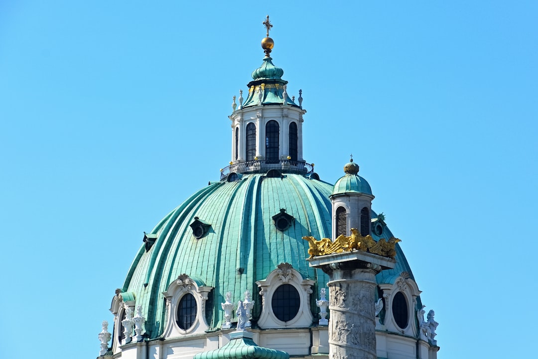 white and green dome building under blue sky during daytime