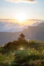 A serene yoga circle at sunrise with ancient stones framing the background.