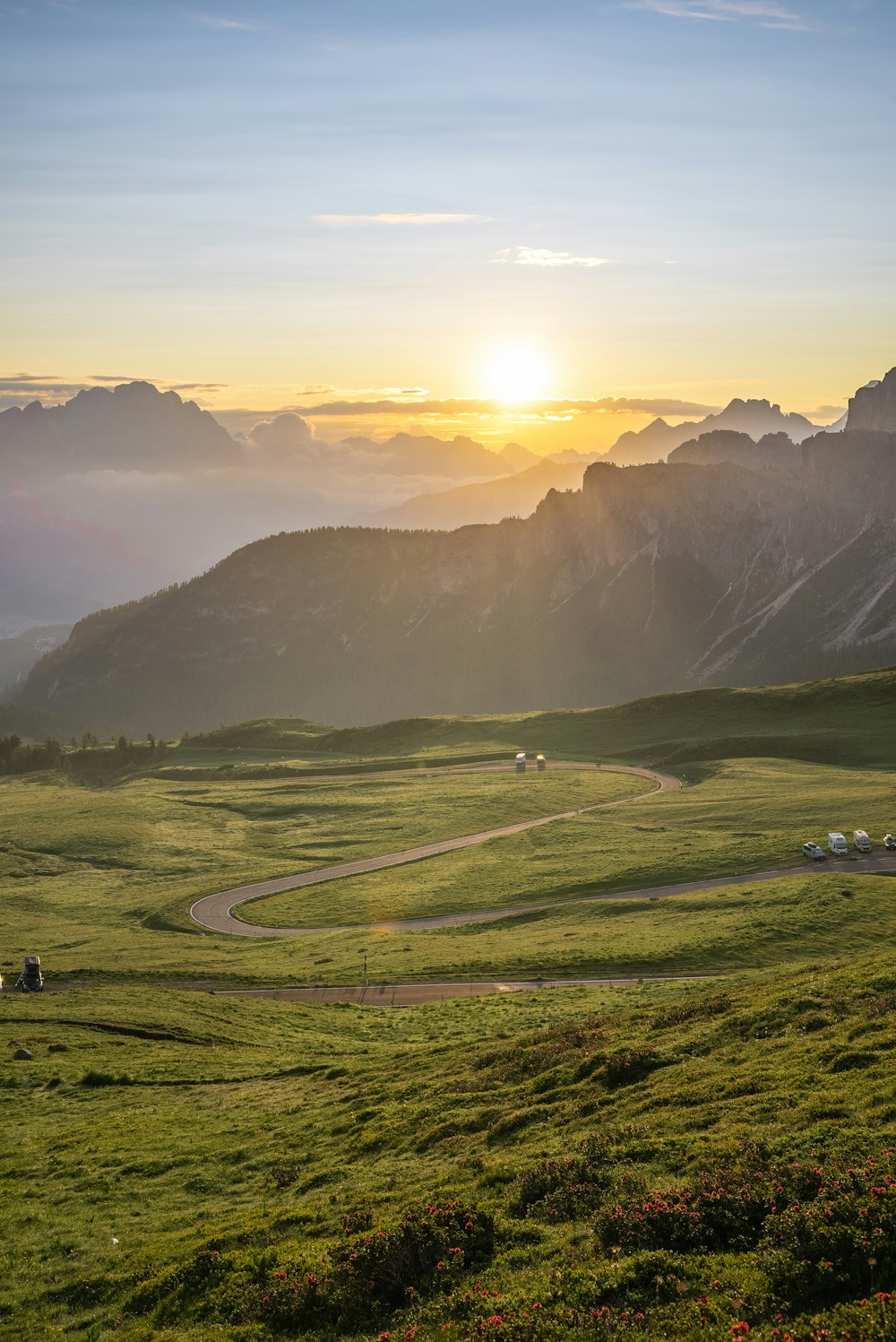 green grass field near mountain during daytime