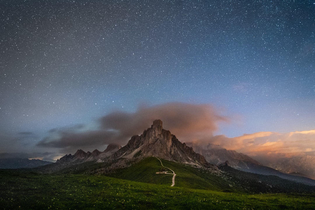 green grass field near mountain under blue sky during daytime, During a night photoshoot session</p></figure><p>We waited for ours, in a cold and windy summer night, to make only some shots of the night sky.</p><p>Nicola Pavan©
