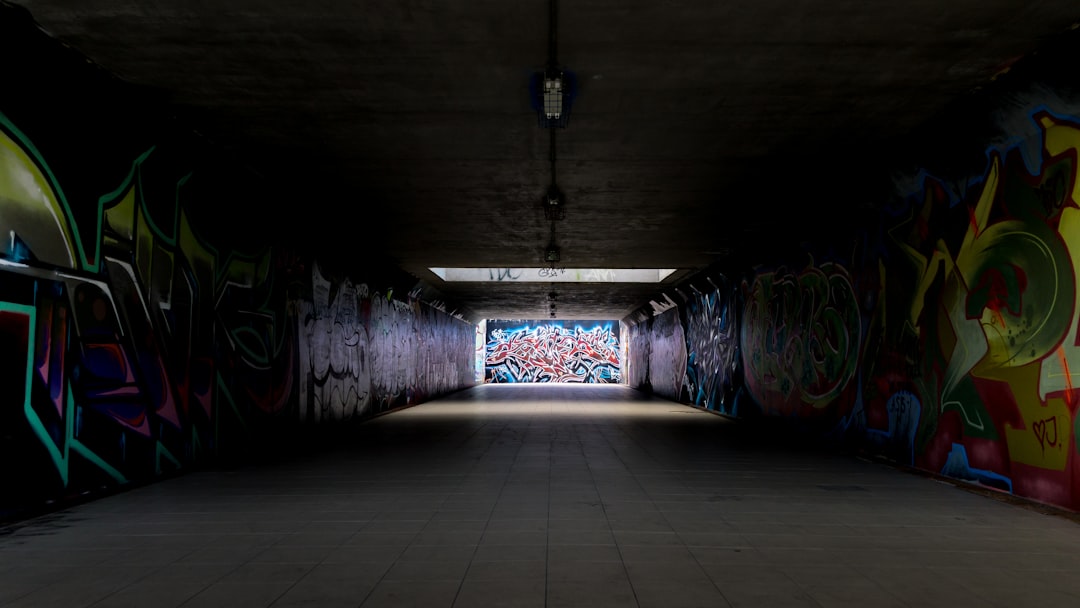 blue and white tunnel with black cross,