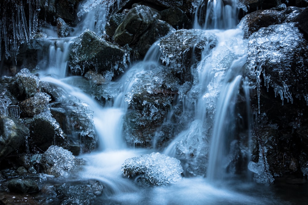 water falls in black rocks