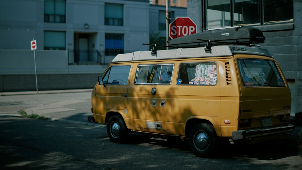 yellow van on road during daytime