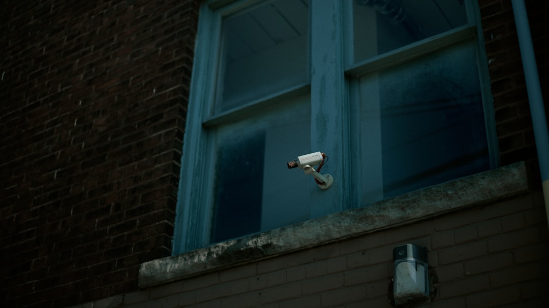 white wall mounted lamp near blue window