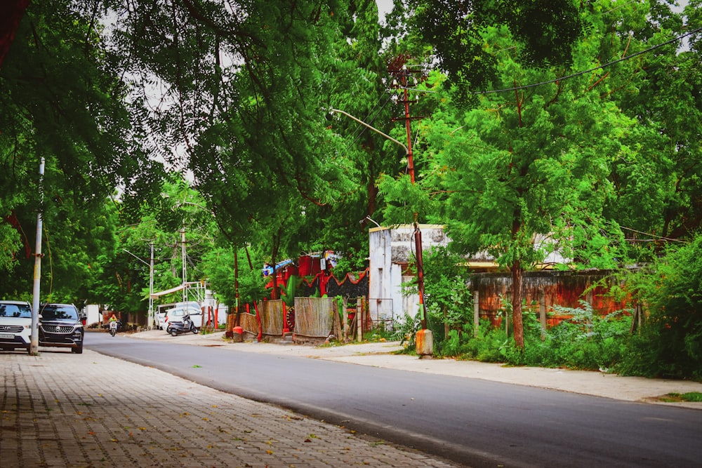 red and white concrete building beside green trees during daytime