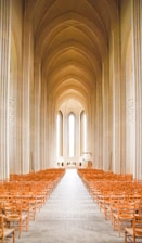 A serene minimalist chapel interior bathed in soft natural light symbolizing peace and grace.