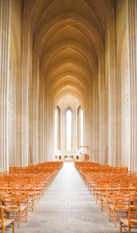 A serene minimalist chapel interior bathed in soft natural light symbolizing peace and grace.