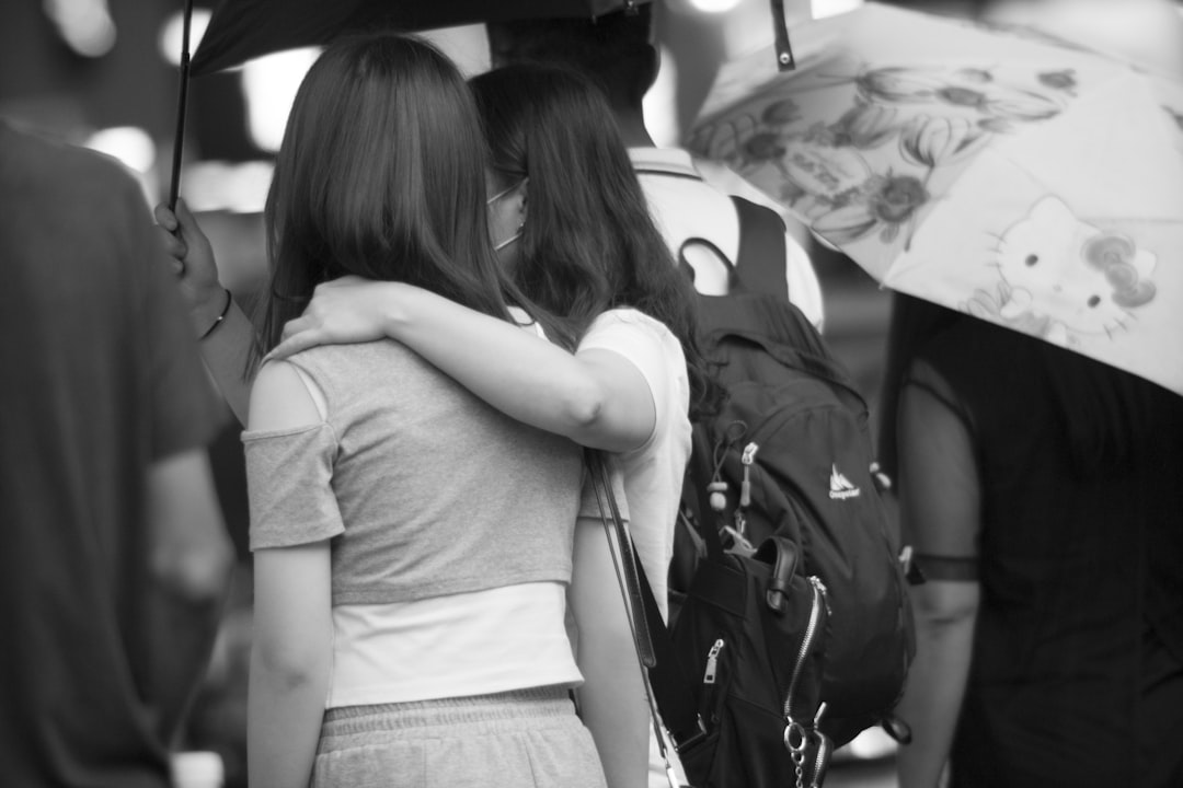 grayscale photo of woman in white t-shirt and black skirt