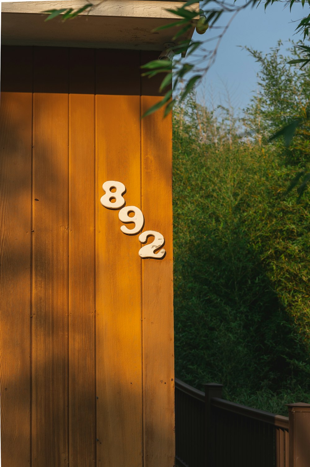 a wooden door with numbers on the side of it