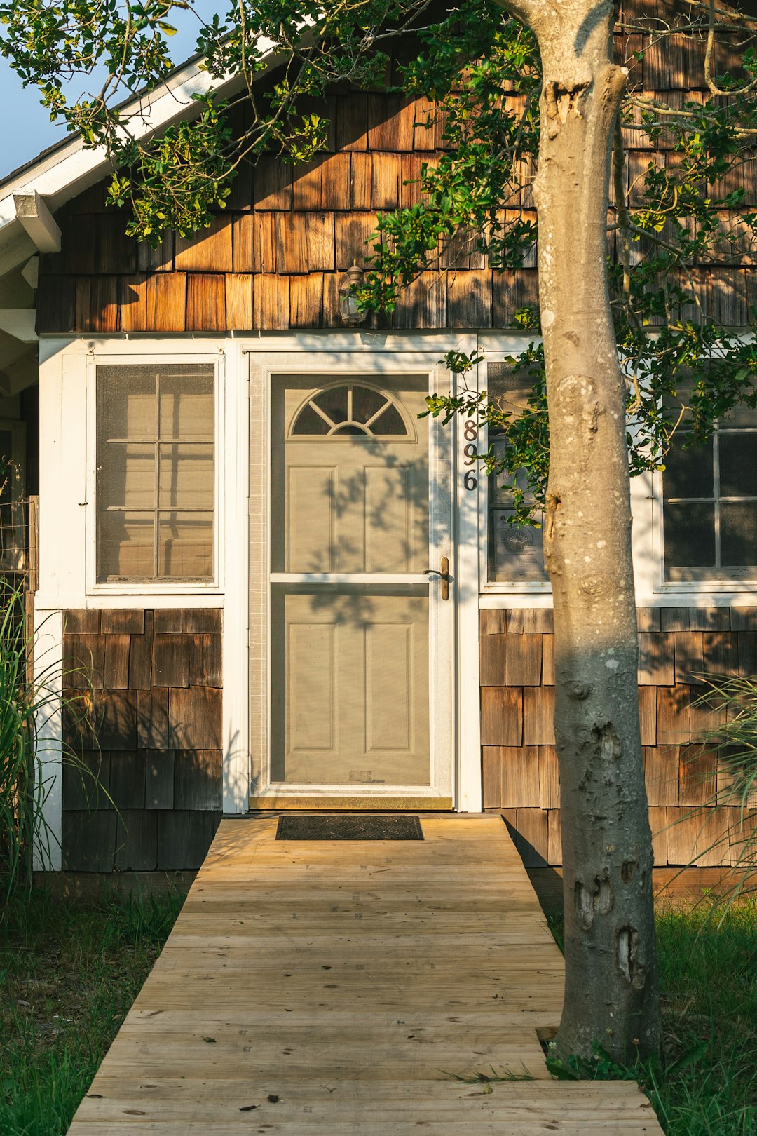 white wooden door with glass panel