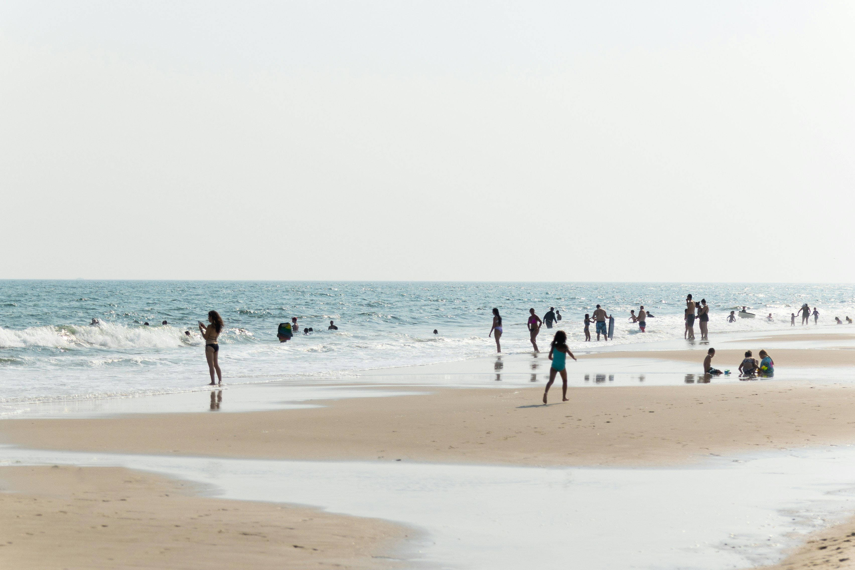 people walking on beach during daytime