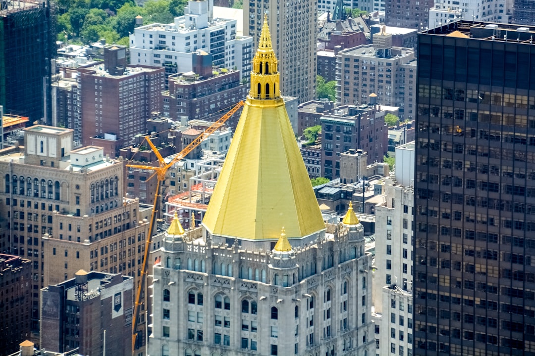 yellow and white tower in the city during daytime
