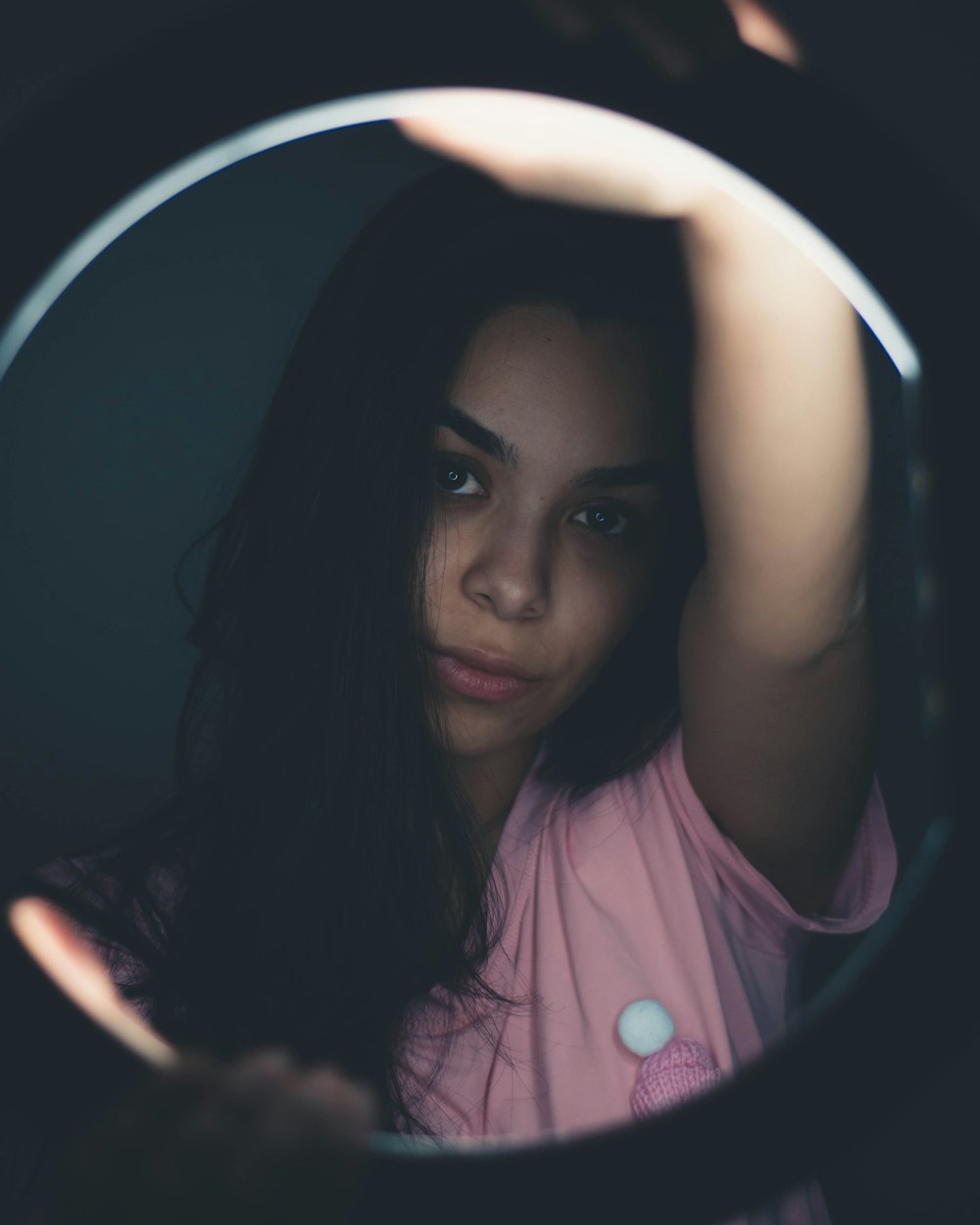 woman in pink shirt smiling