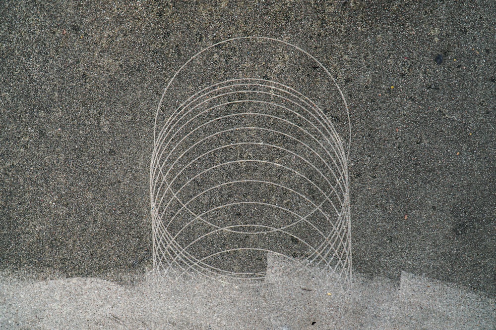 grey metal round frame on grey concrete floor