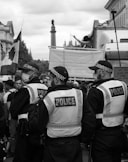 grayscale photo of people in a street