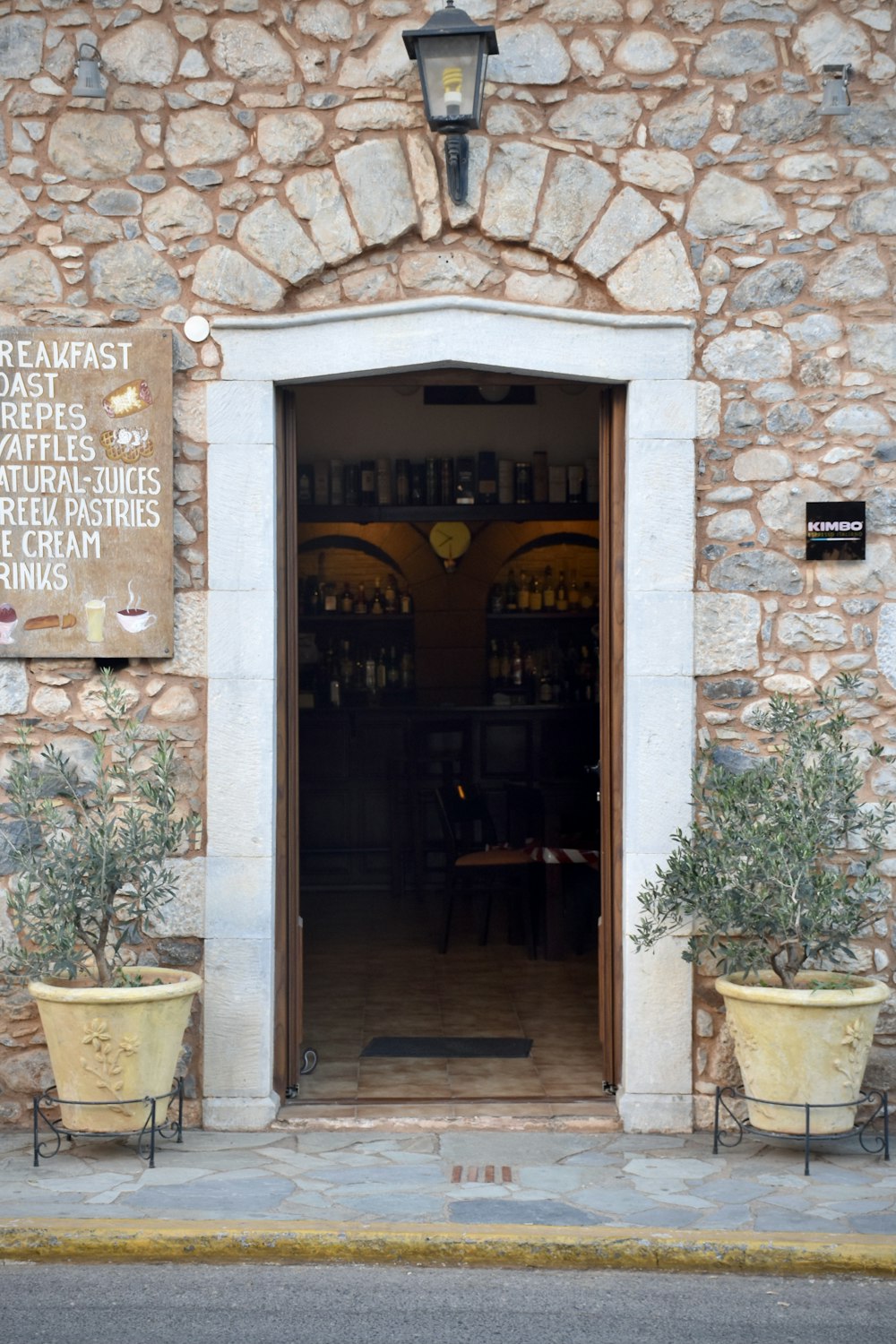 brown wooden door with brown brick wall