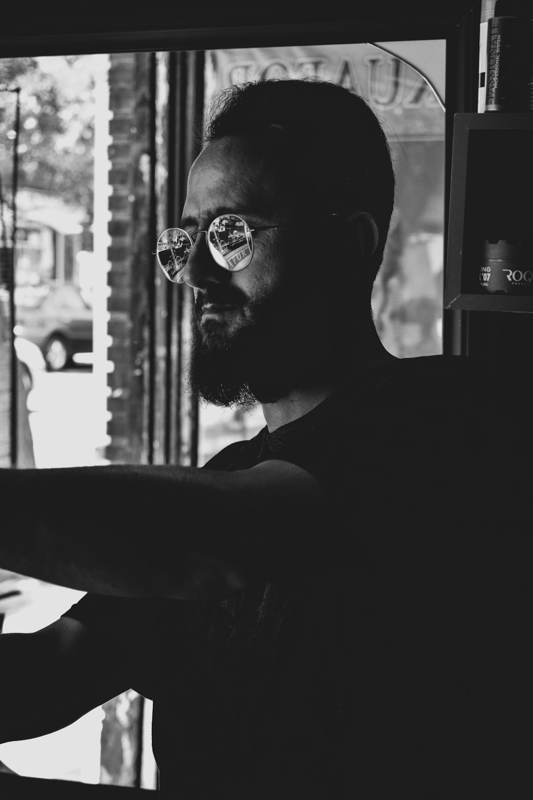 man in black tank top wearing eyeglasses