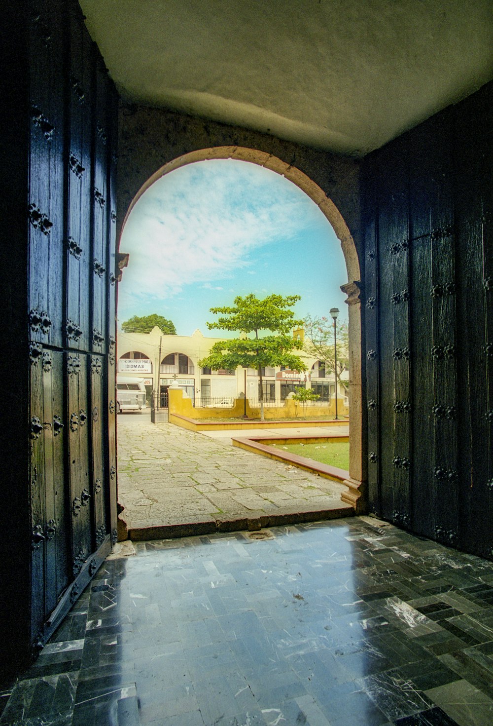 black wooden door with glass