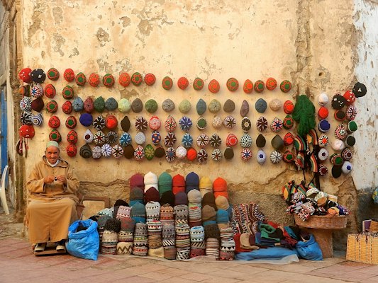 People sitting on floor with balloons — Essaouira, Morocco
