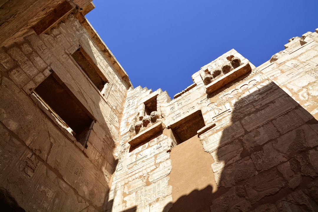 brown concrete building under blue sky during daytime