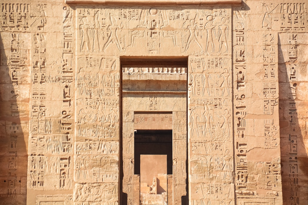 brown concrete building with brown wooden door