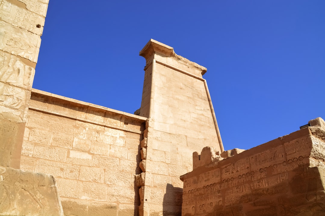 brown concrete building under blue sky during daytime