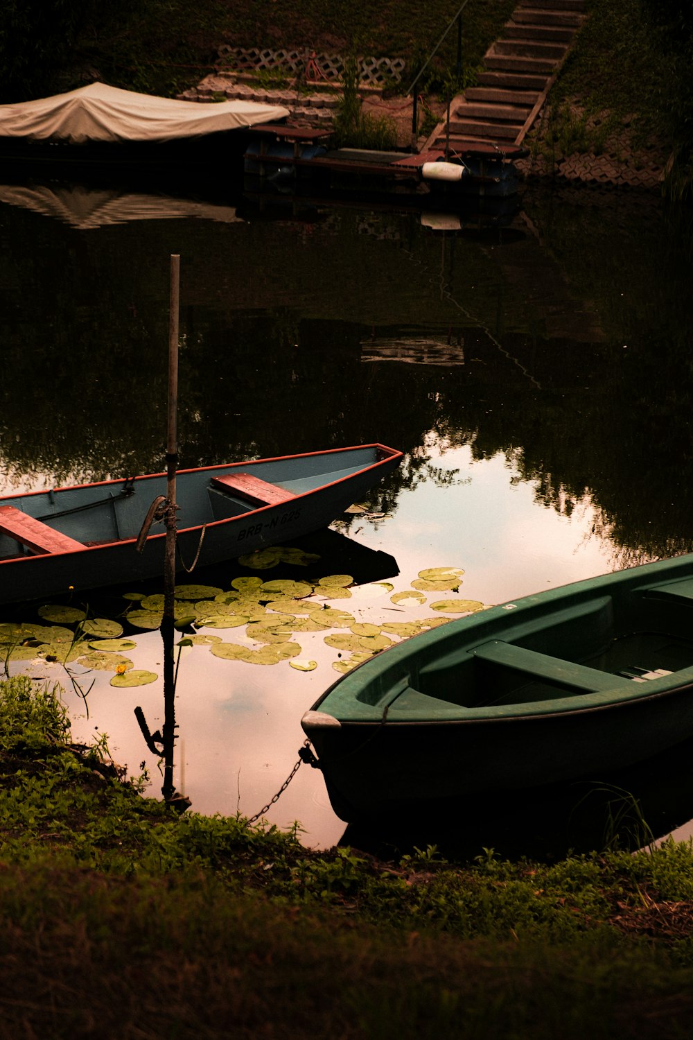 white and red boat on water