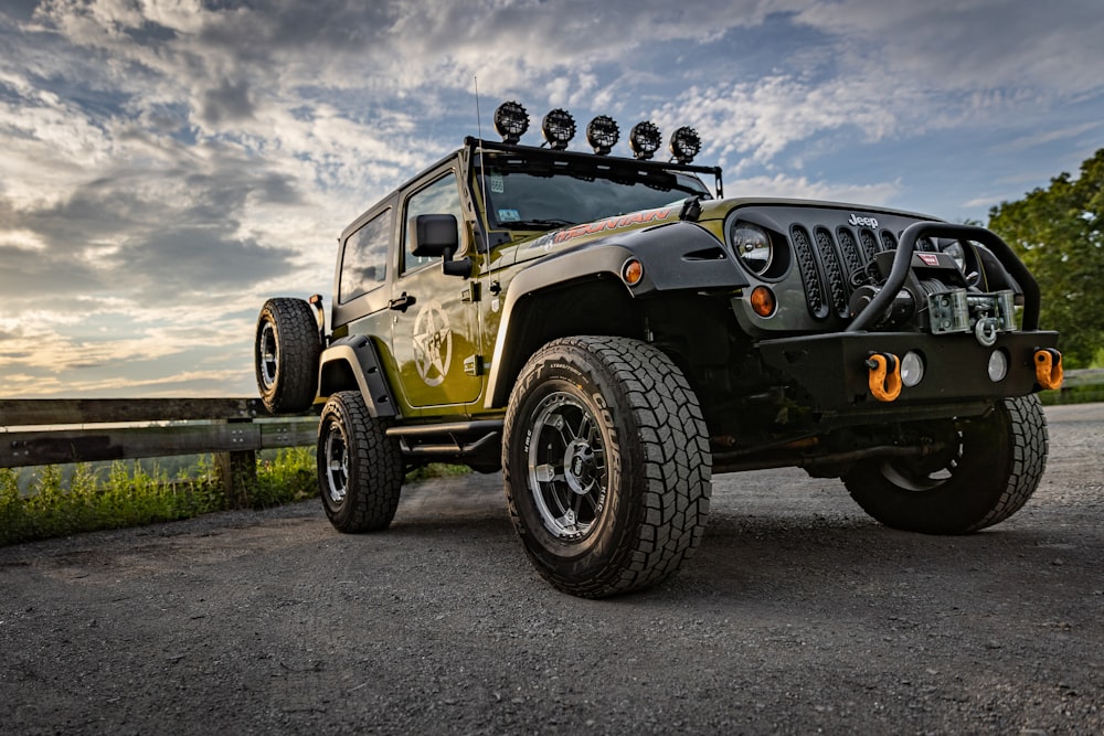 black jeep wrangler on gray asphalt road during daytime