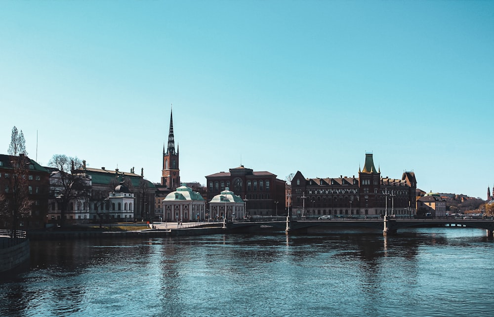 body of water near buildings during daytime