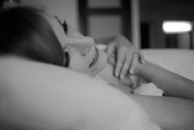 Side view of a person peacefully sleeping on a lyvidapillow with smooth skin visible