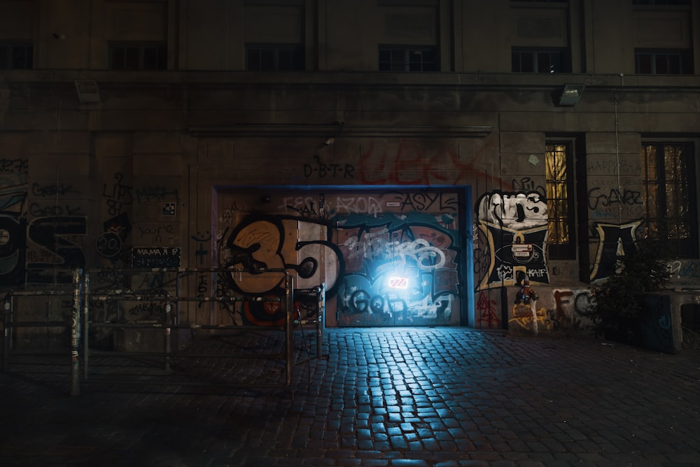 blue and white graffiti on wall