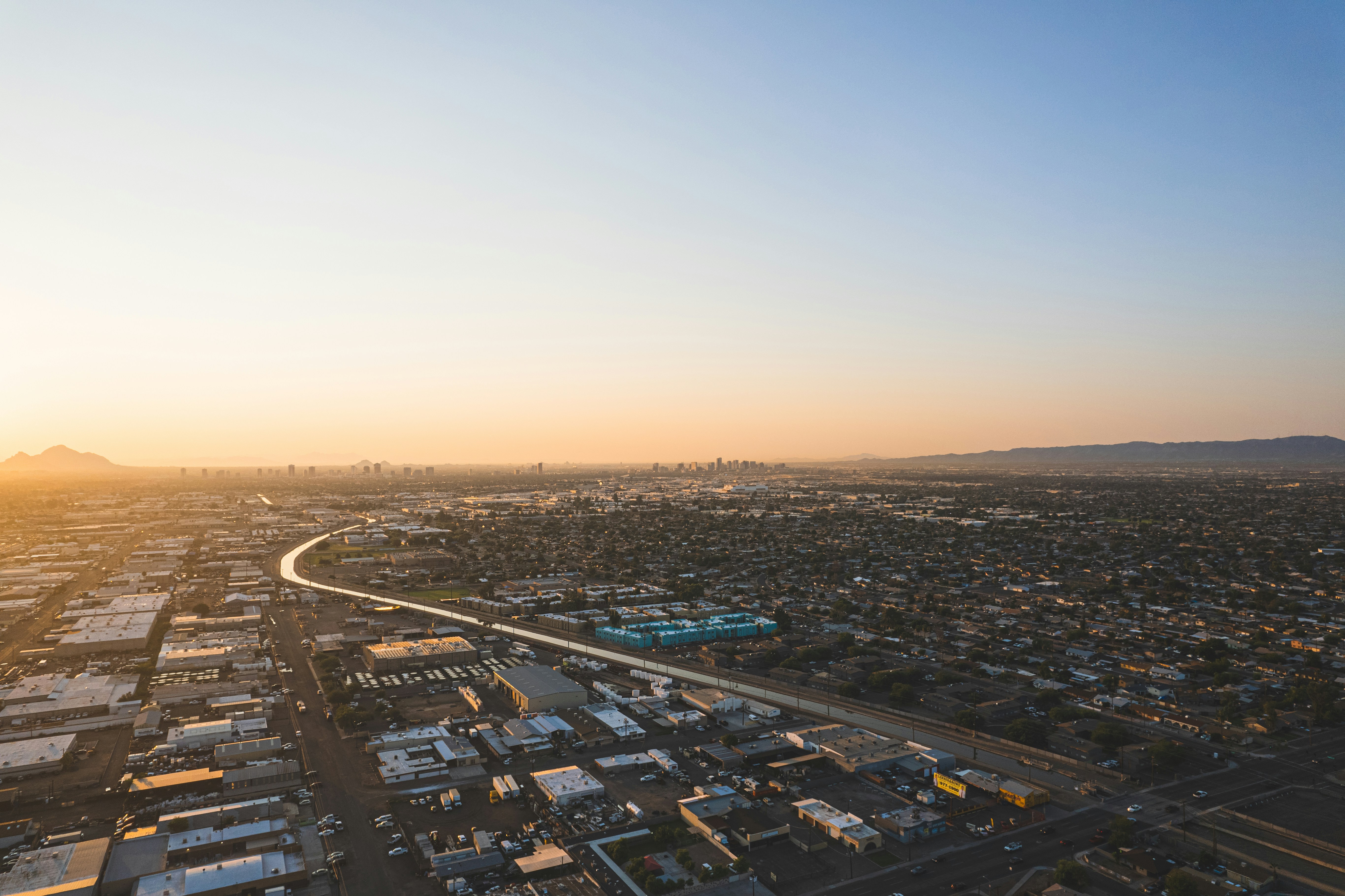 aerial view of city buildings during sunset, 