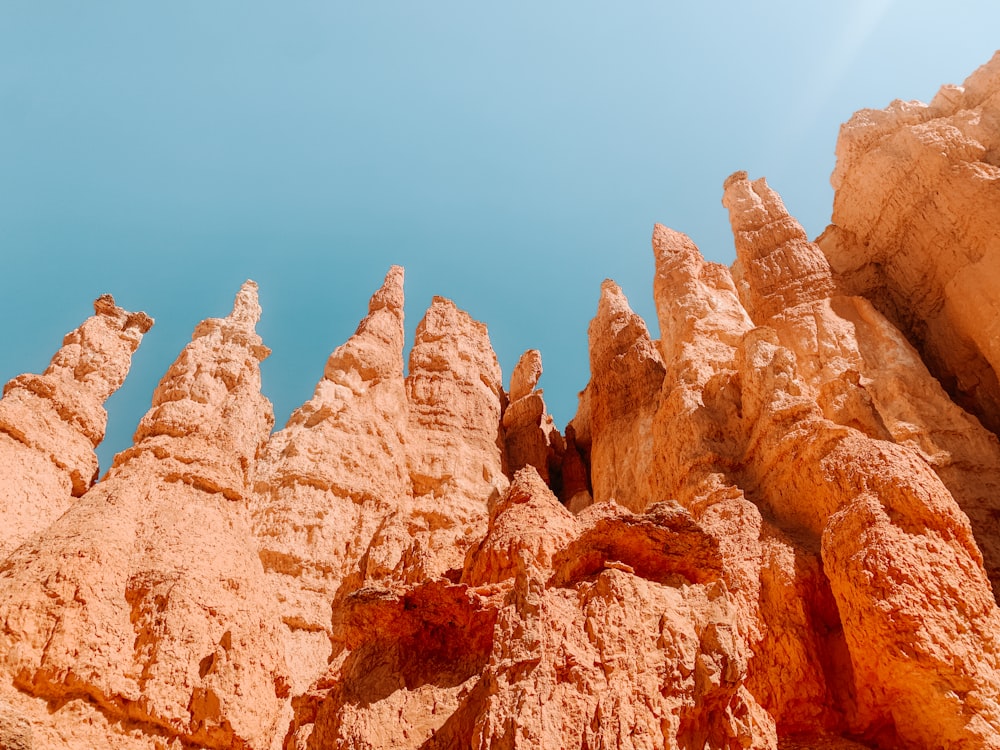 brown rock formation under blue sky during daytime