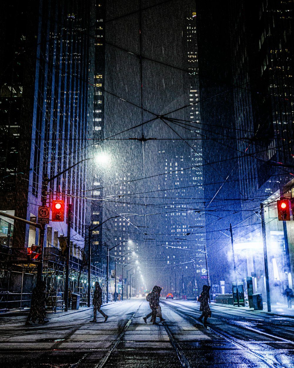 person walking on street during night time