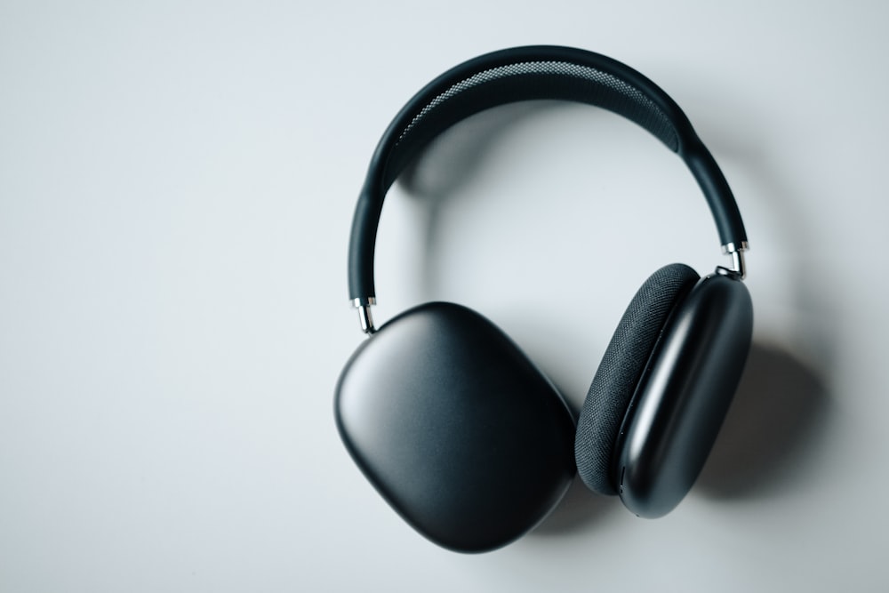 black wireless headphones on white desk