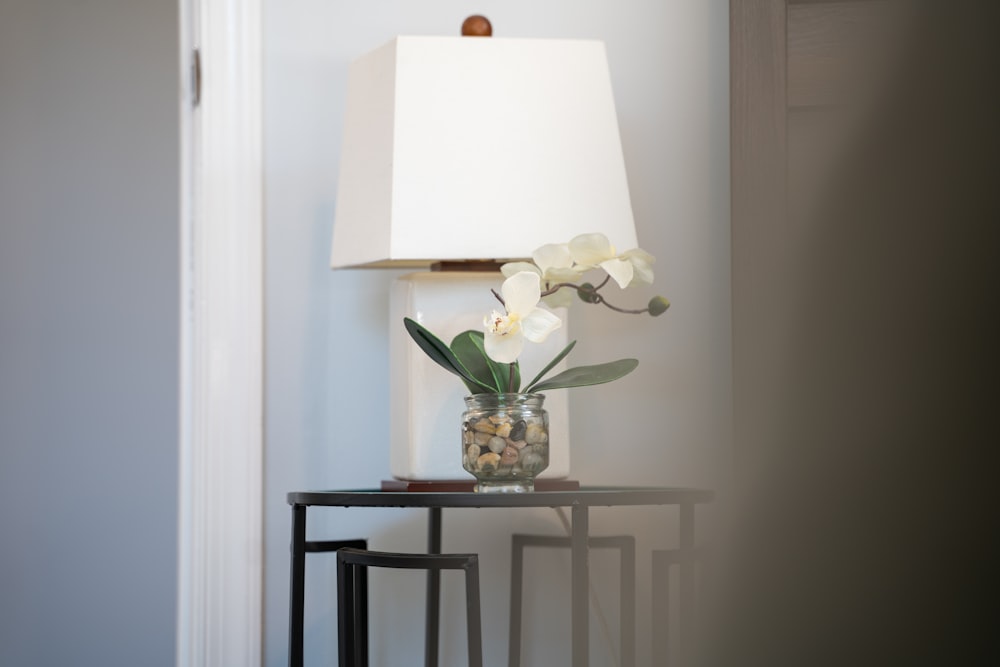 white table lamp on glass table