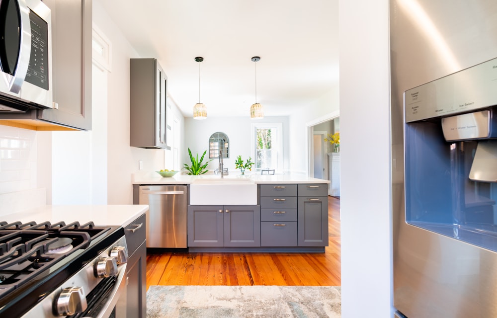 white wooden kitchen cabinet with kitchen sink