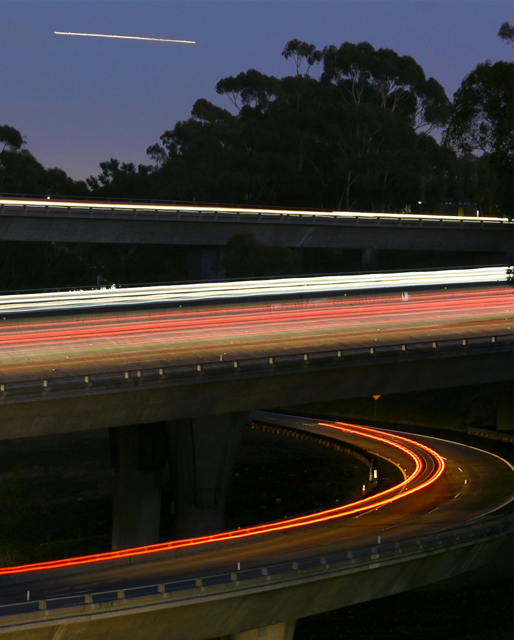 time lapse photography of cars on road during night time