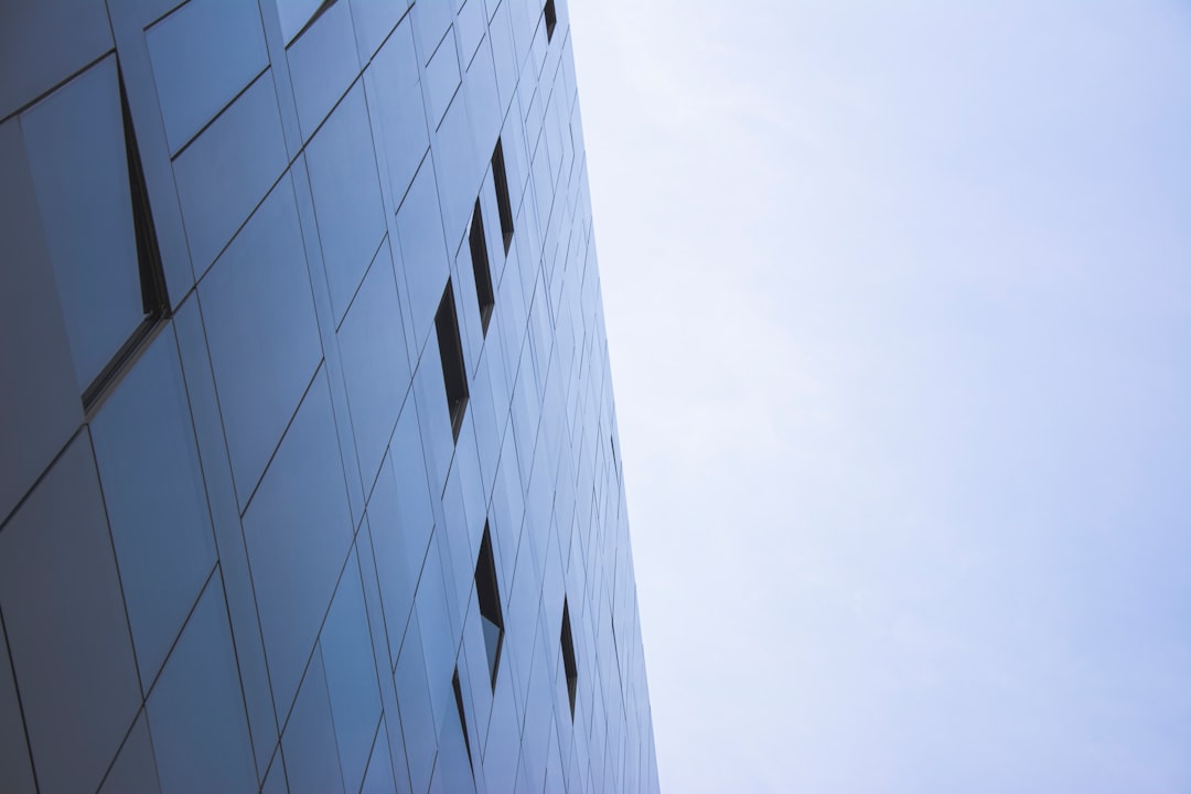 white concrete building under white sky during daytime