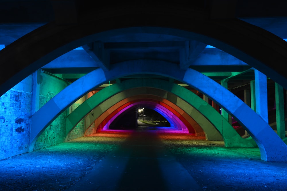 green and blue tunnel with lights
