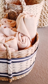 brown textile on white woven basket