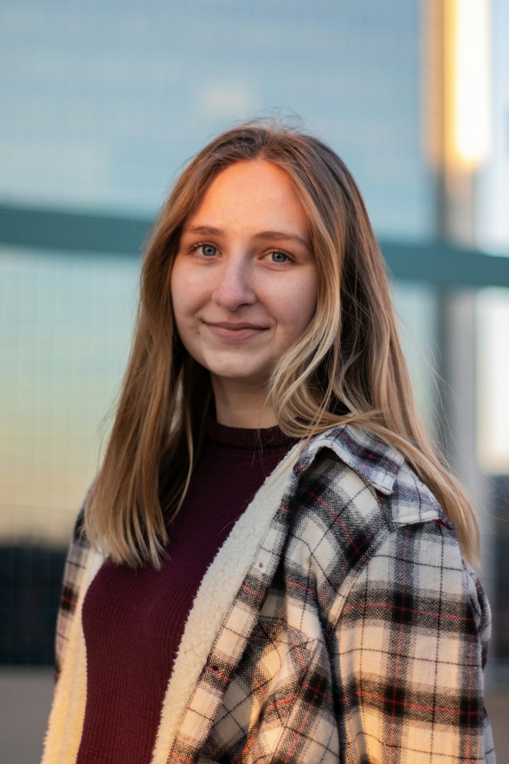 woman in red white and black plaid scarf