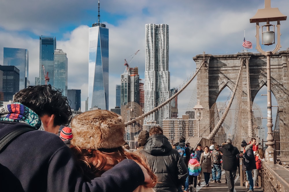 people walking on bridge during daytime