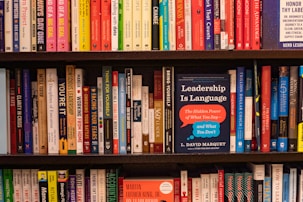 books on brown wooden shelf