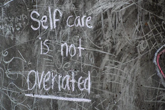 white and black quote on gray wall