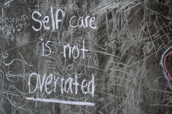 white and black quote on gray wall